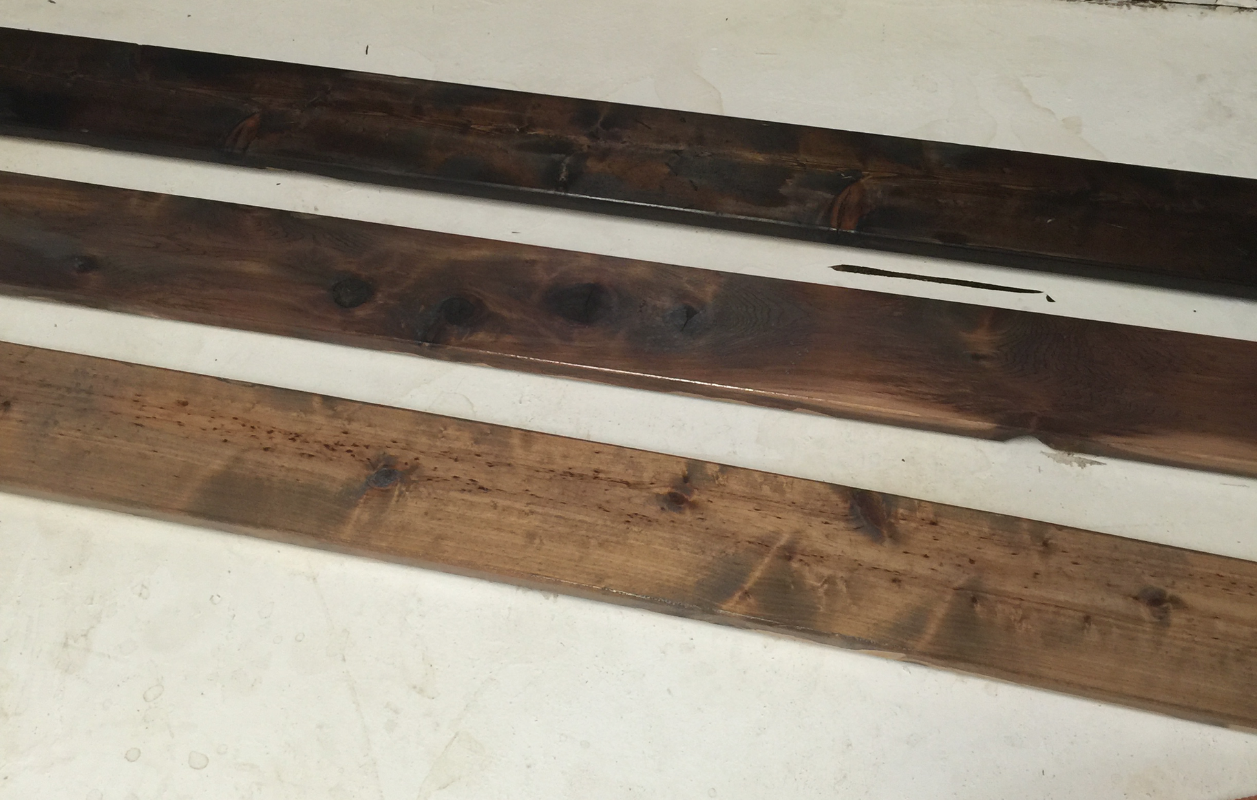 I started by staining with Minimax stain. The top board is Expresso, the middle board is Dark Walnut and the bottom Weathered Oak. I stained the sides so if the boards were uneven you would not see unstained wood. We used new pine boards from Home Depot (our weekend date night hangout).