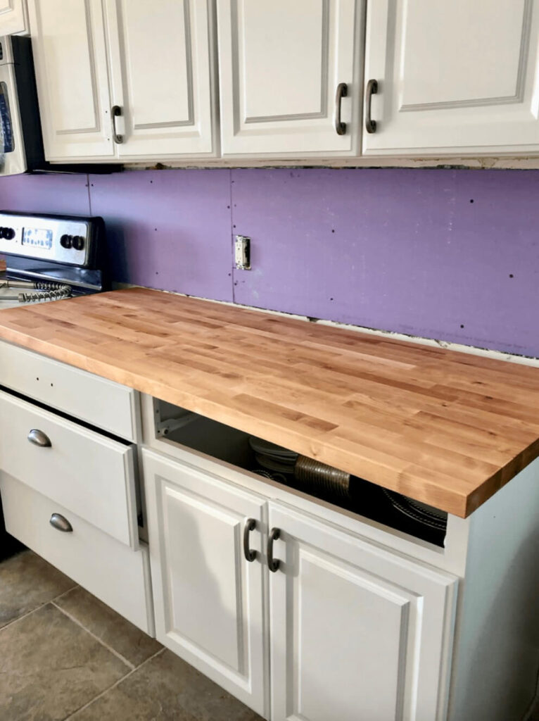 In process pic of Staining butcher block countertops.