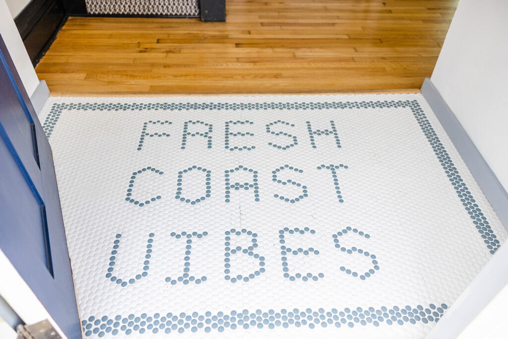 Penny tile Spelling Out Fresh Coast Vibes in blue and White.