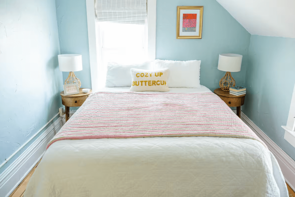 Small Bedroom with light blue walls.