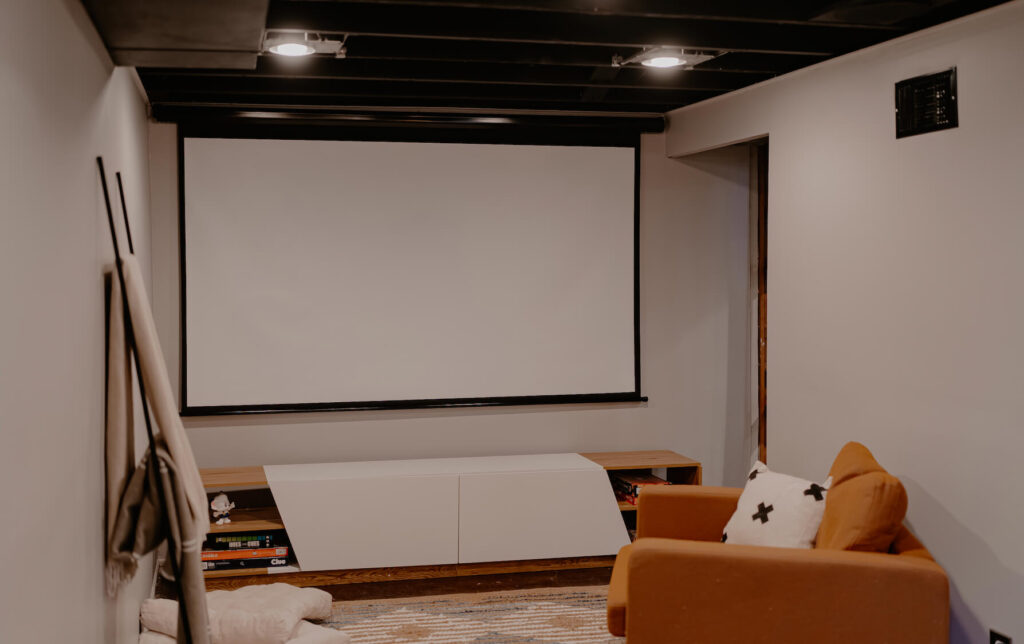 Basement Theatre Room with Black painted ceiling.