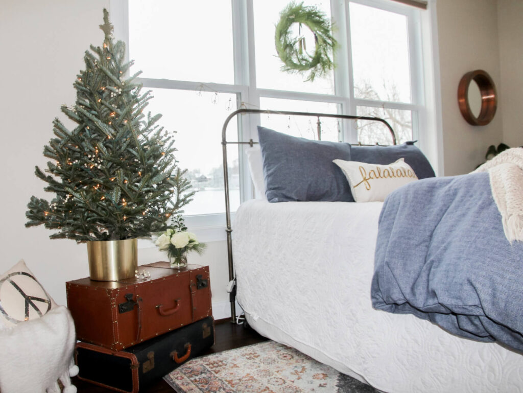 A Tabletop Christmas Tree and Vintage Suitcases