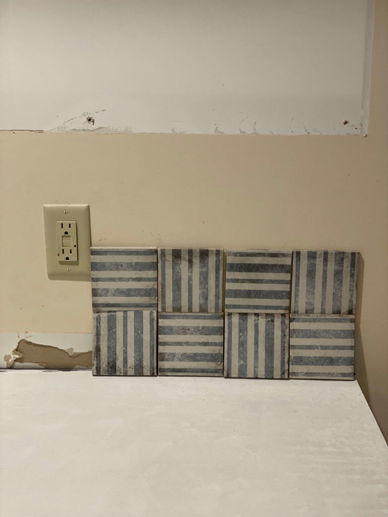 Blue and White striped tile in a patchwork grid