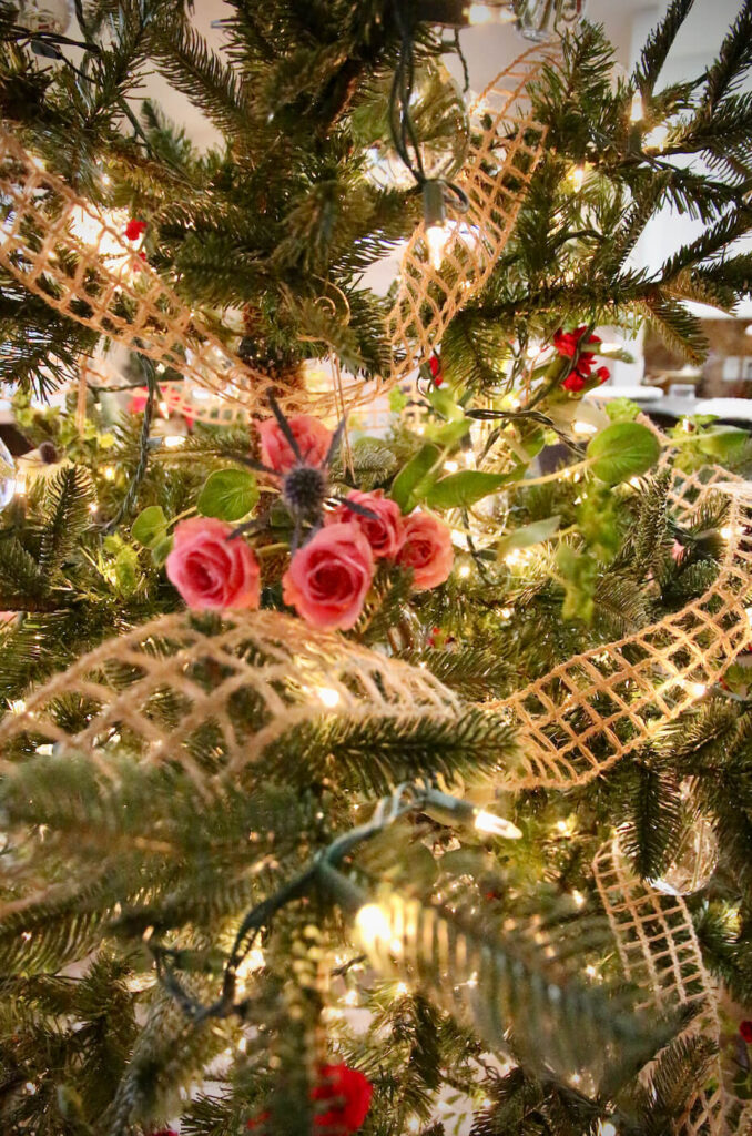 Fresh cut flowers decorate a Christmas Tree.