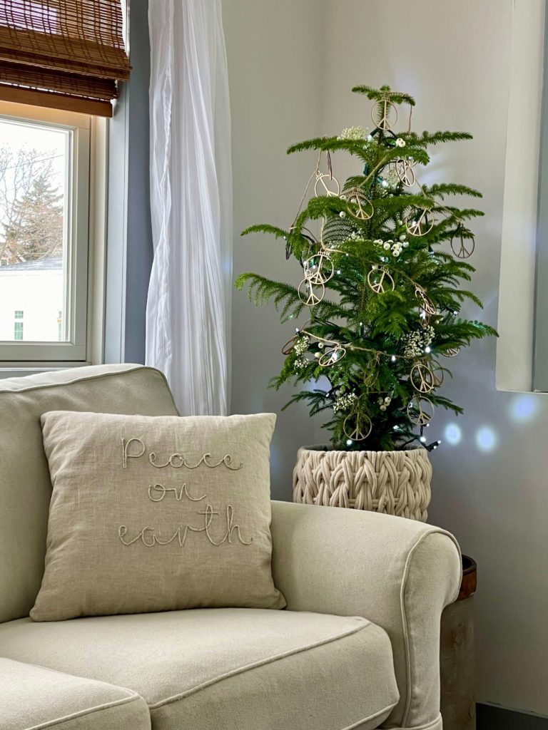 Decorating with neutrals for Christmas. Lots of whites and creams along with natural elements and a tabletop tree.