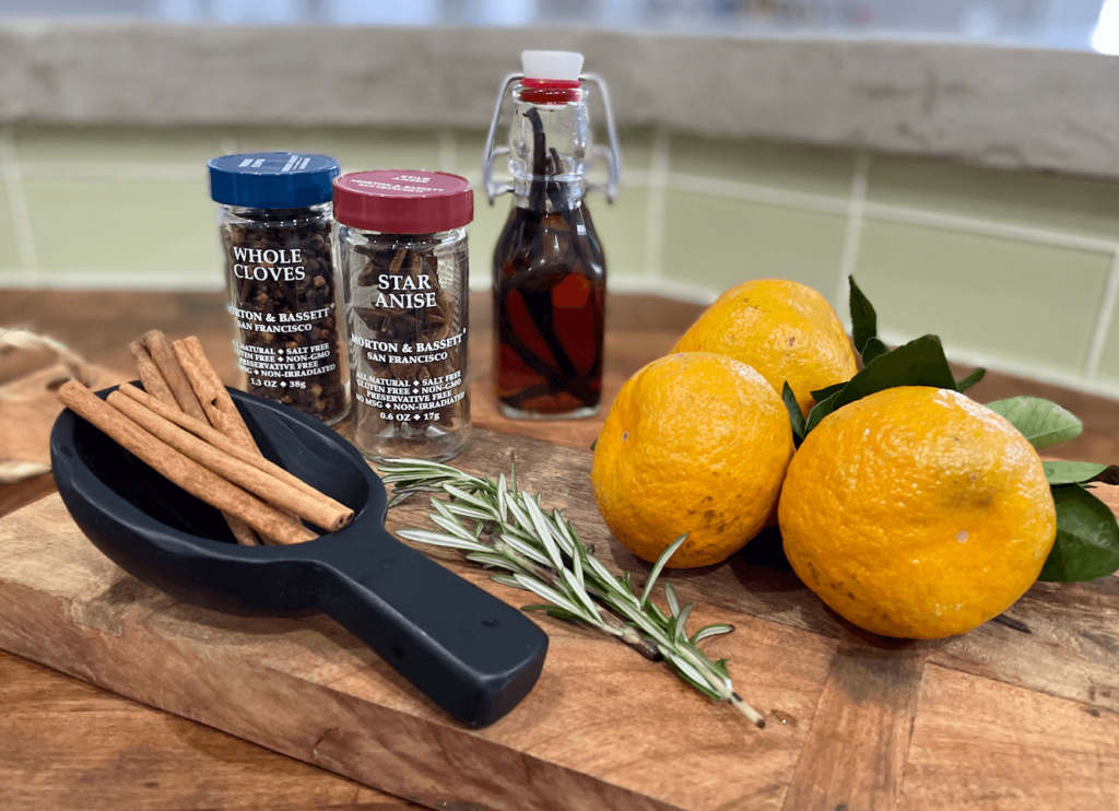 Ingredients for Christmas simmer pot mandarin oranges, fresh rosemary, cinnamons, Vanilla and star of anise and cloves.