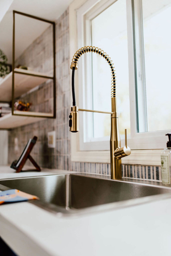 Gold finished faucet in a Modern Cottage Kitchen remodel
