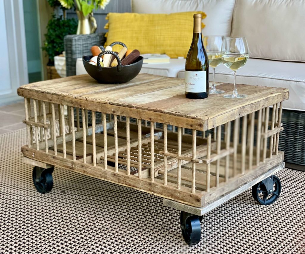 Chicken crate as a vintage coffee table mixed with modern furniture.