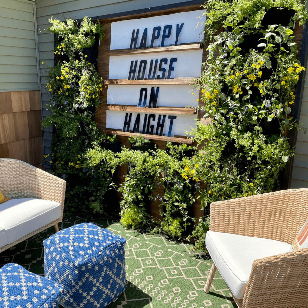 Giant letter board on outdoor living wall at an Airbnb.