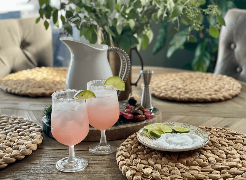Pink Margaritas are perfect for celebrating love. Table showing ingredients for margaritas.