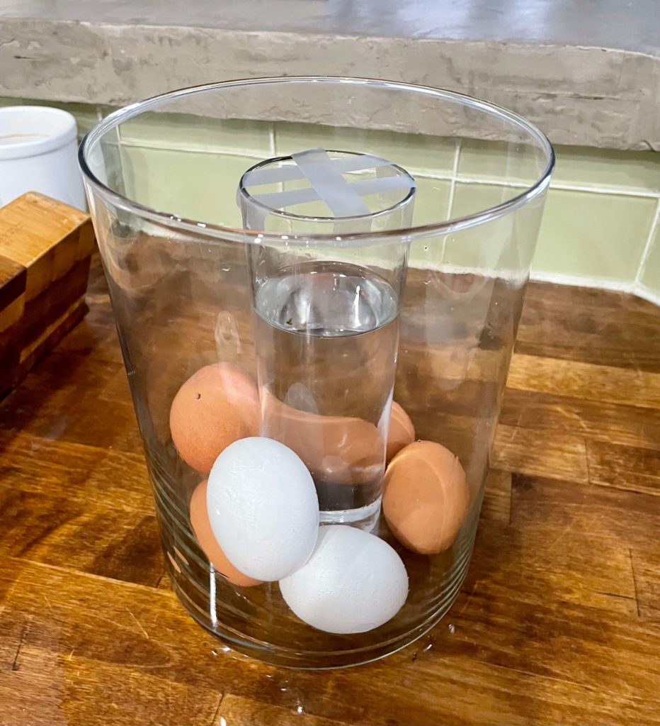 Hurricane vase with eggs
