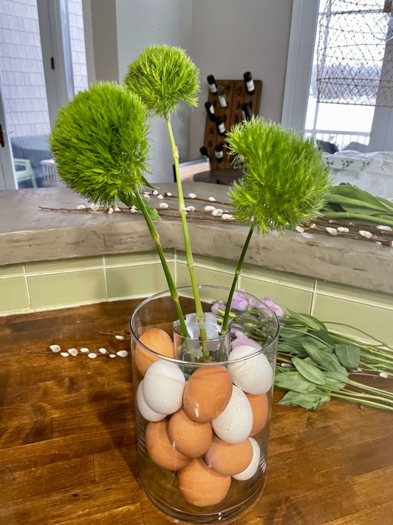 Assembling Spring arrangement with Easter eggs.