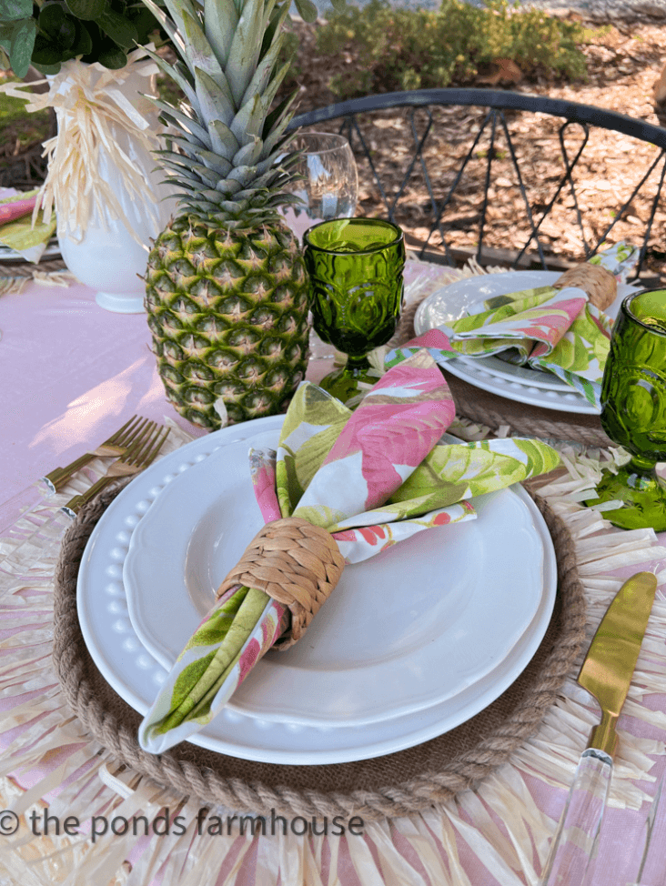 Pineapple and pretty napkins in a table setting.