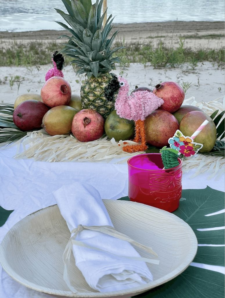 Beach scene featuring a quick and easy tropical tablescape.
