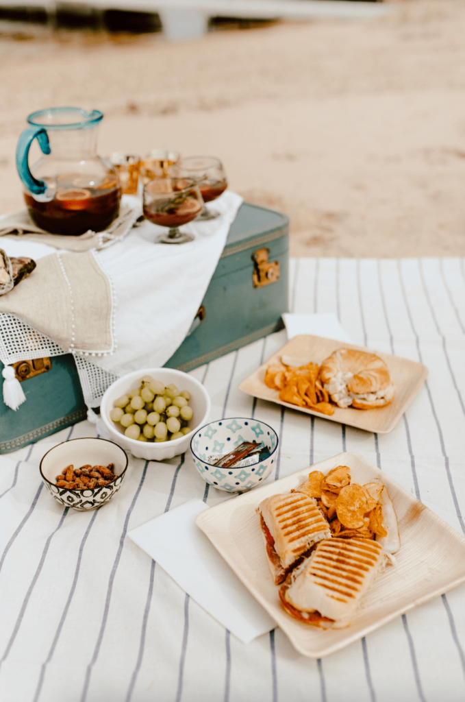 Vintage suitcase elevates an everyday picnic with sandwiches.