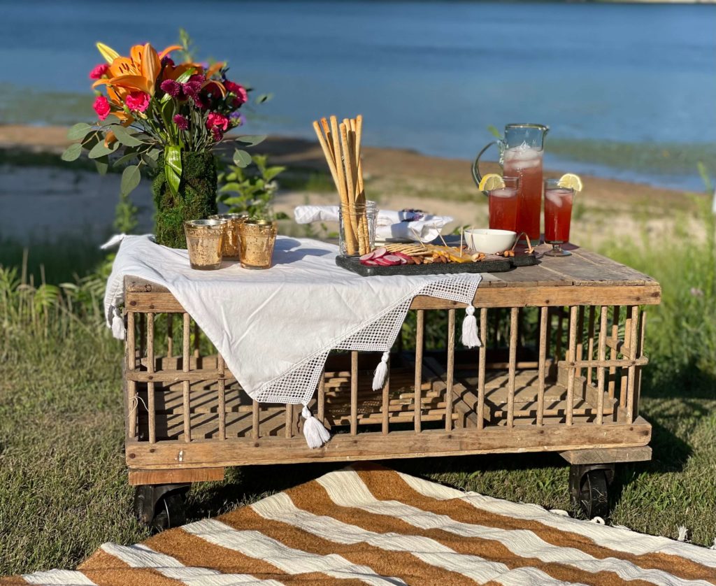 Easy ways to elevate your picnic featuring a vintage crate and pretty tablescape.