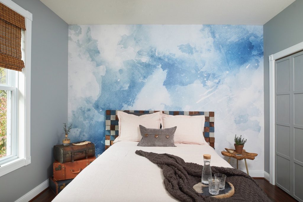 Wallpaper in a bedroom refresh with textured headboard.