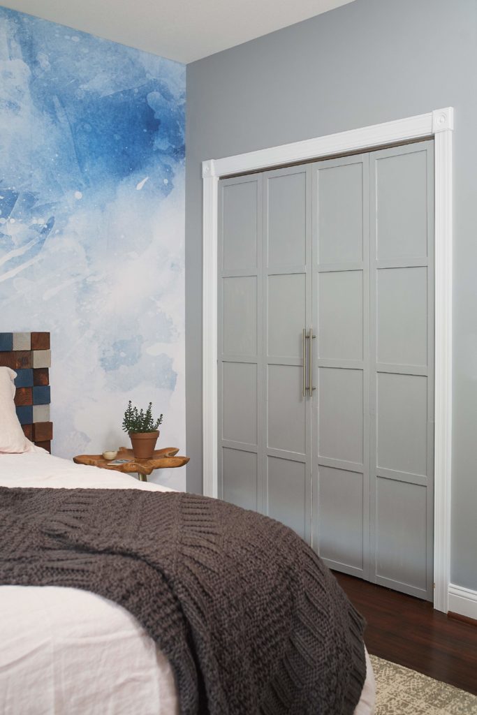 Grey closet bi-fold doors updated in a bedroom refresh.