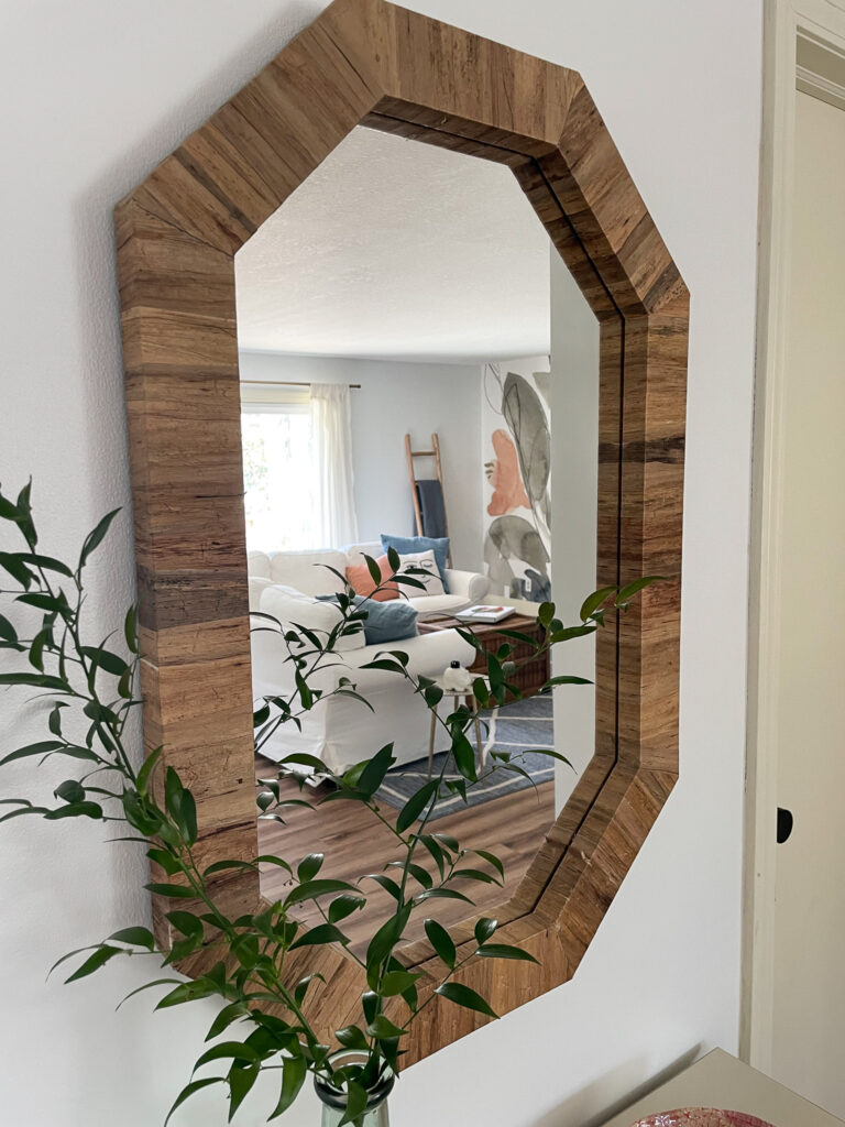 Thrifted mirror shown in a living room.