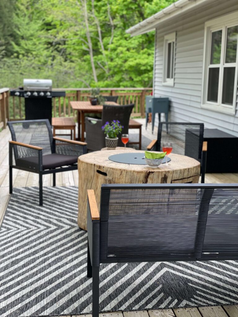 Deck with outdoor furniture. fire table and grill.