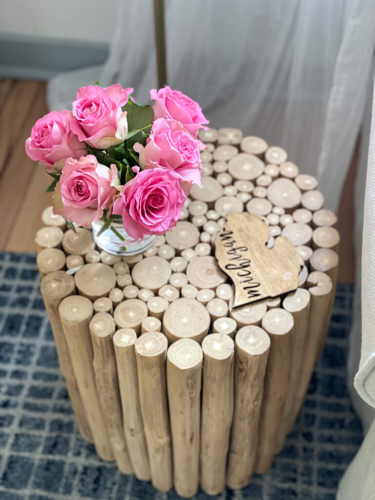 Cottage decor updates featuring pink roses on wood side table.
