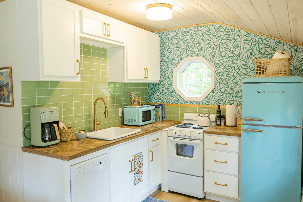 Vintage Cottage Kitchen Style with Wood ceilings, retro fridge and butcher block countertops.