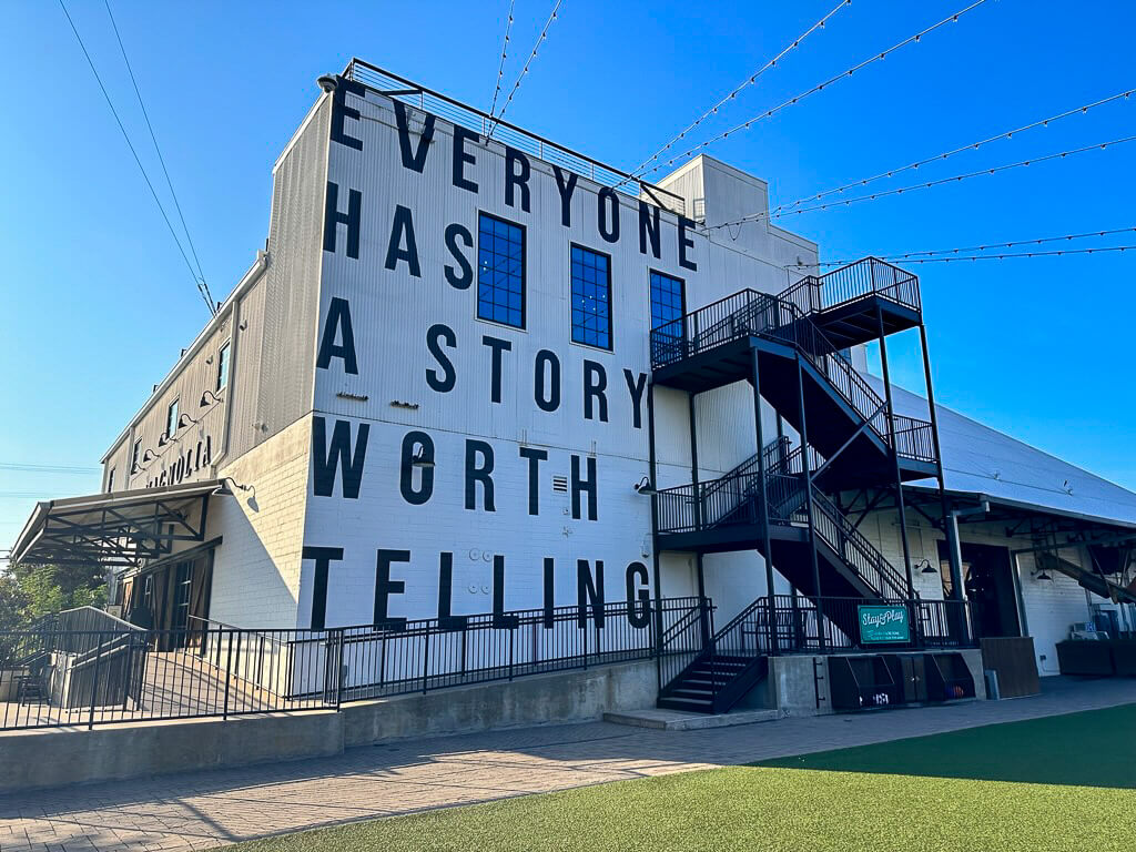 Building at Magnolia  with the words Everyone Has A Story worth Telling