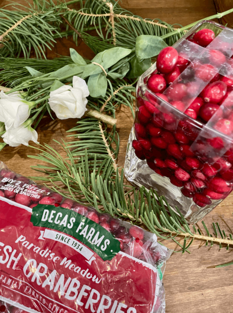 Cranberries and grocery store flowers for a DIY Christmas Centerpiece.