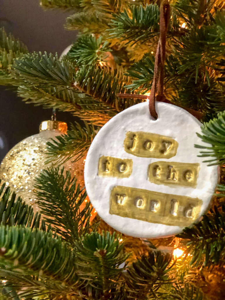 DIY Clay Ornaments hanging from a Christmas Tree.