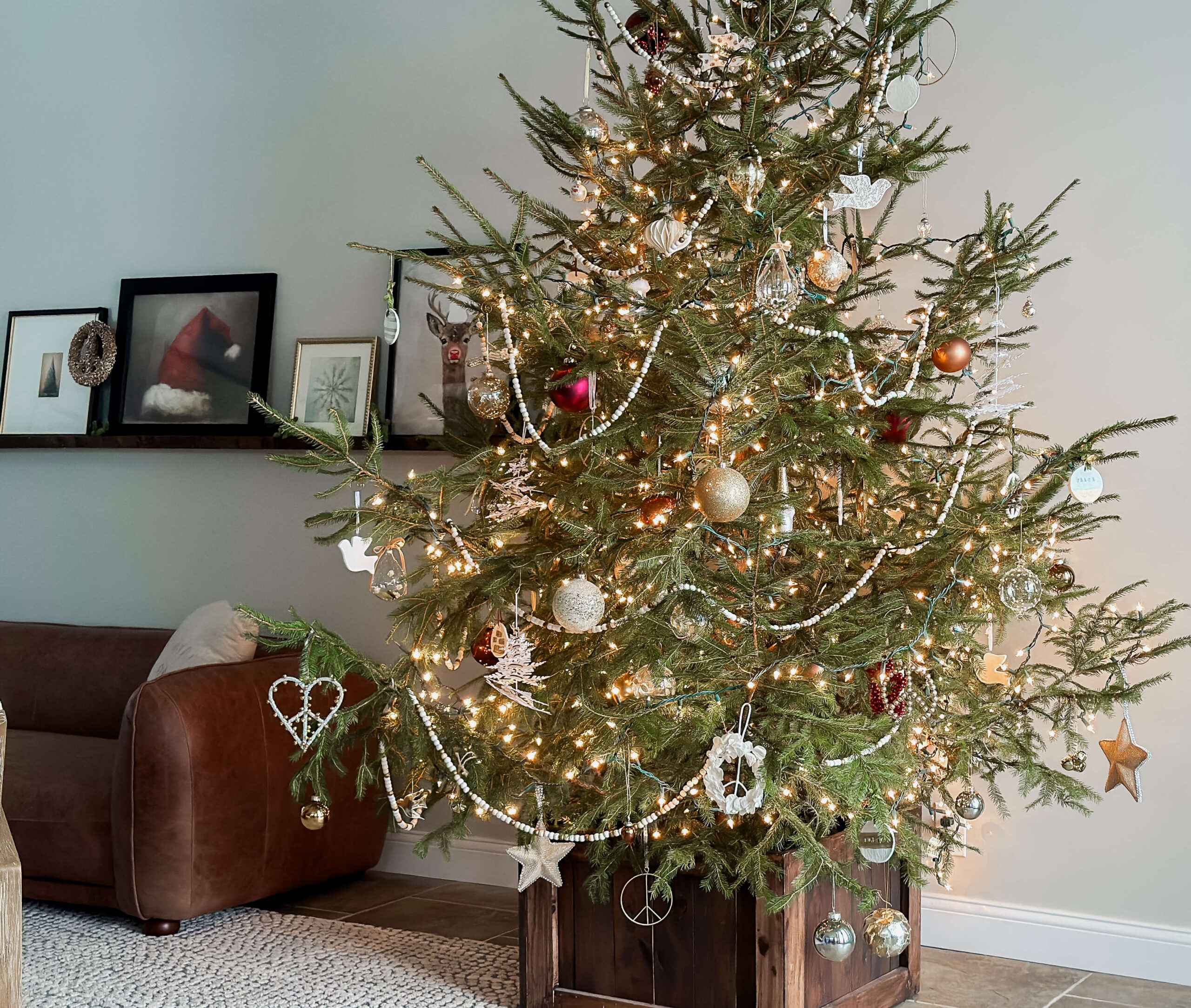 Fresh Christmas tree decorated with natural elements.