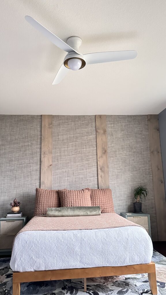 Bedroom with grasscloth wallpaper accent wall