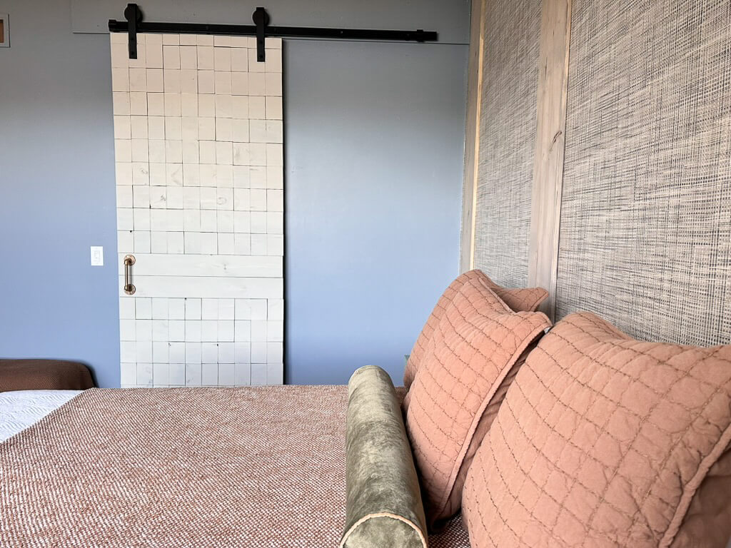 Refreshed bedroom featuring a DIY sliding barn door
