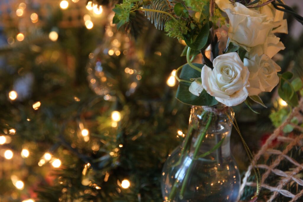 Close up of fresh flowers on a Christmas tree.