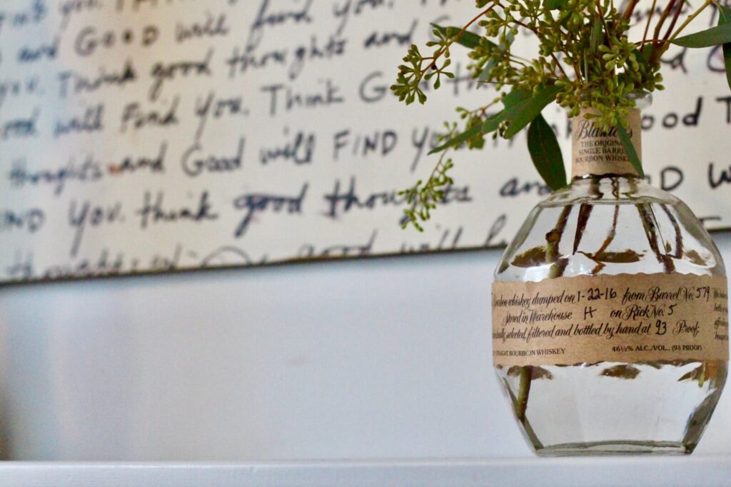 Bottle filled with greenery to add a cozy vibe to your home.