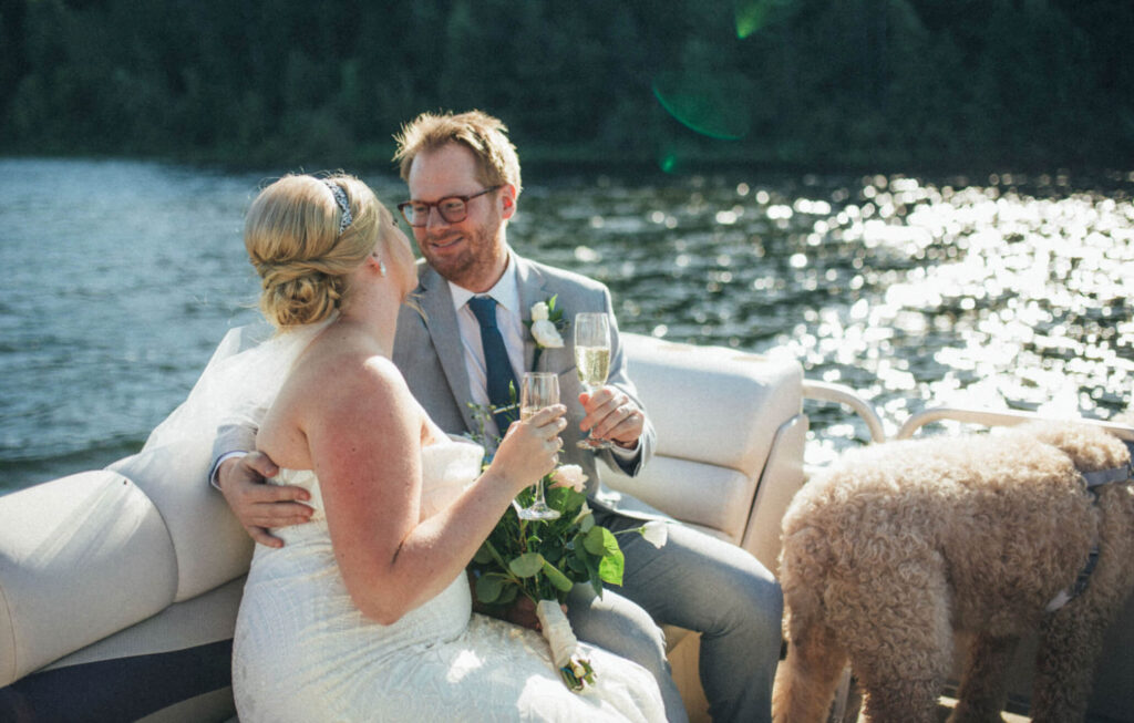 Bride and From take a pontoon ride after getting married on a Lake.