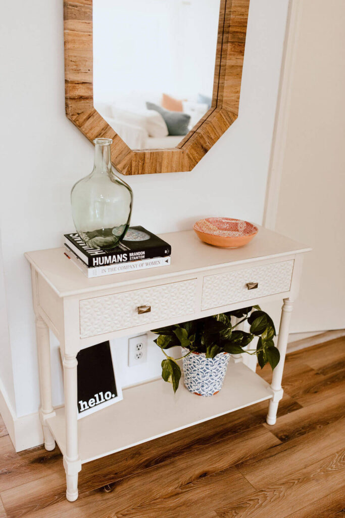 Entry Table with Books and mirror.