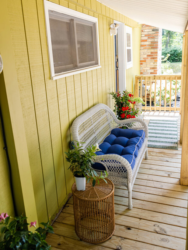Front Porch of a green cottage in Pentwater, MI