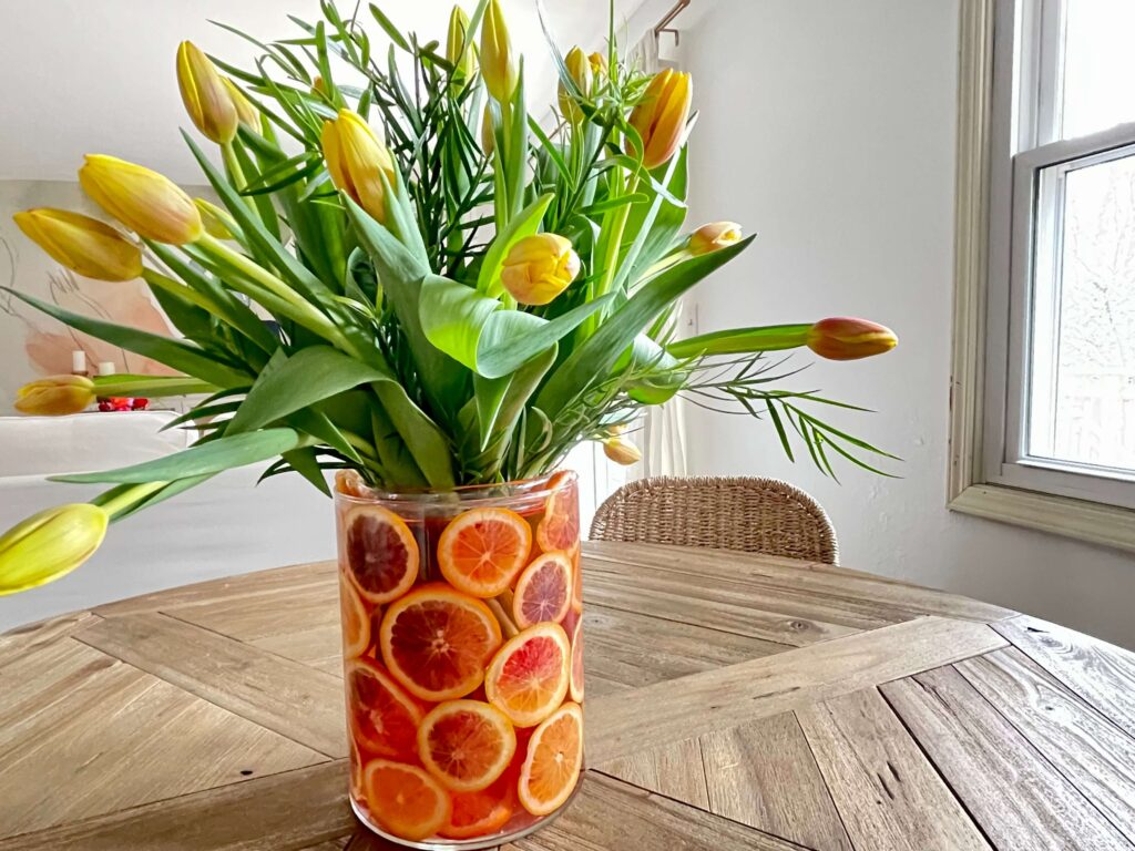 Bright citrus and flower DIY centerpiece. Perfect for Summer.