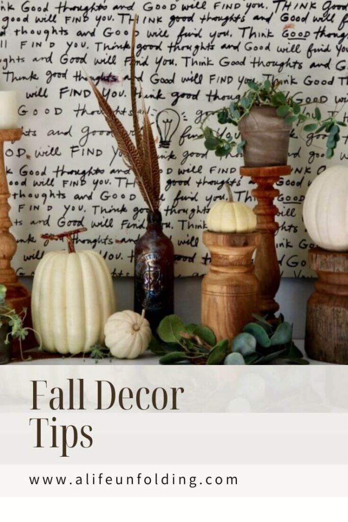 Wood Candle sticks with Plants and mini pumpkins.