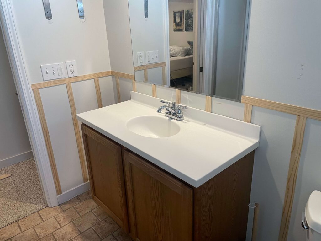 In process pic of a budget bathroom makeover with DIY Board and Batten.