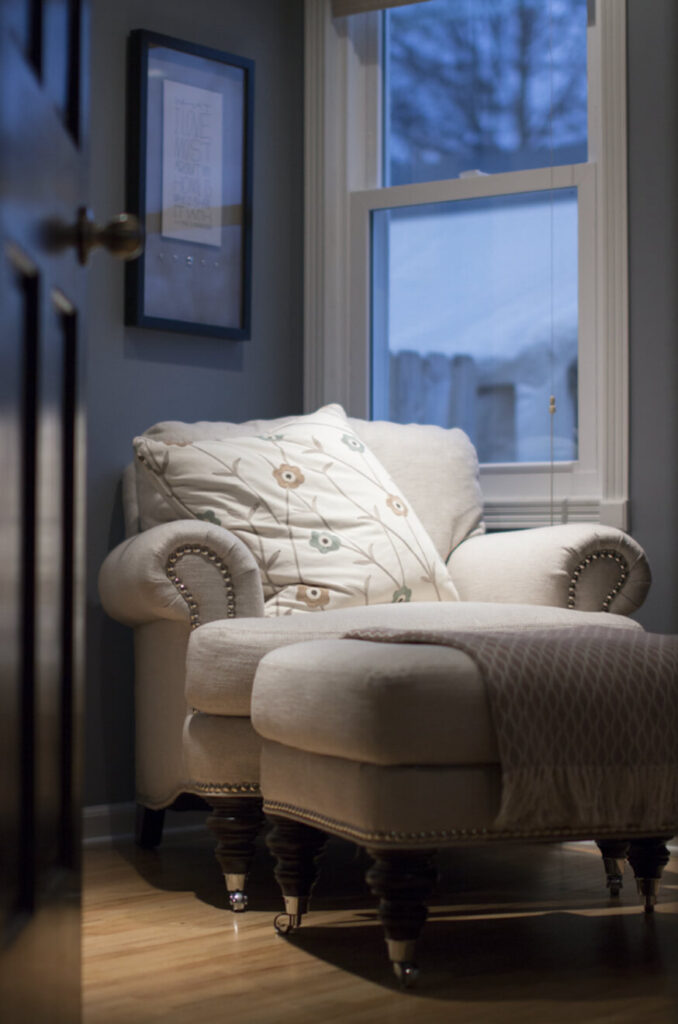 White cozy chair in Airbnb.