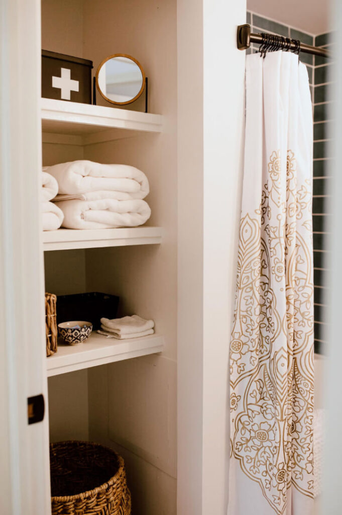 Bathroom at Short-Term Rental stocked with towels and other items.