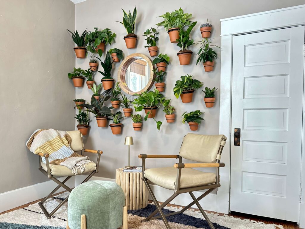 Wall filled with live plants in a biophilic design.