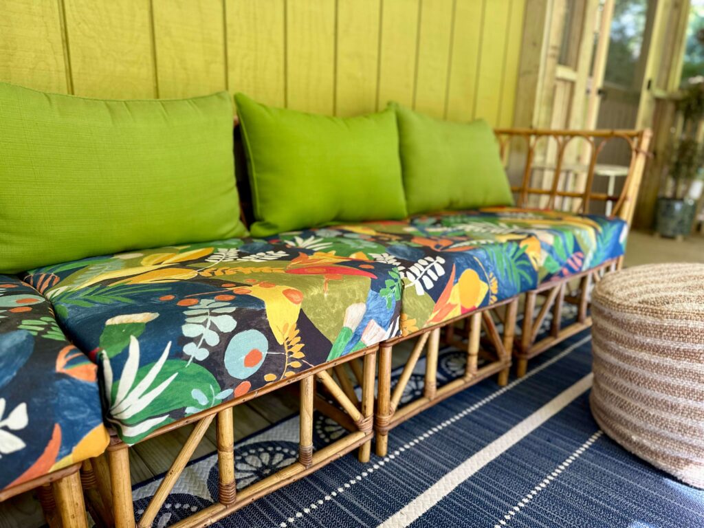 Vintage sofa with DIY outdoor cushions in a bright pattern.