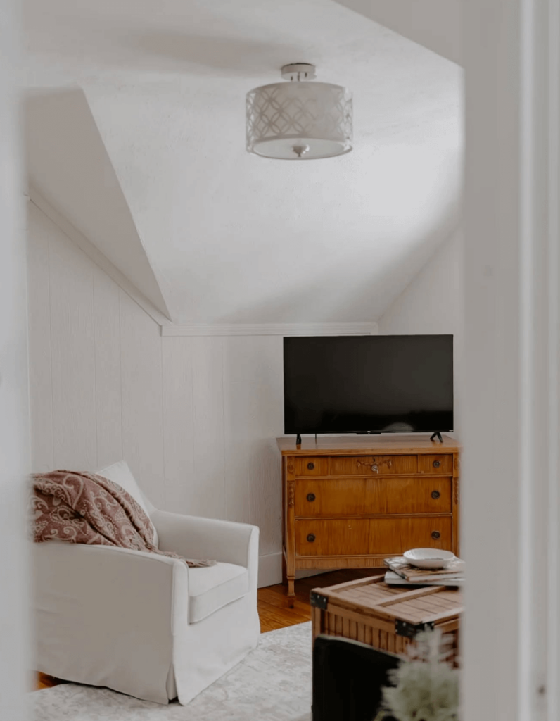 Vintage dresser as TV stand in Living Space