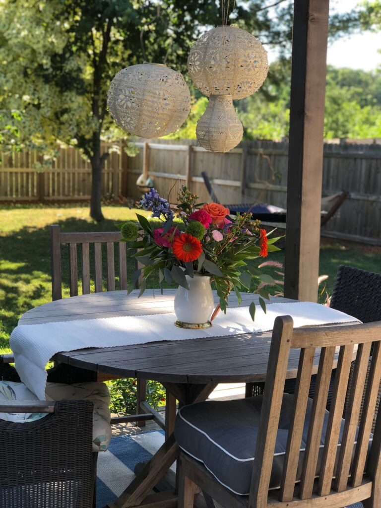 Outdoor dining table with solar lanterns.