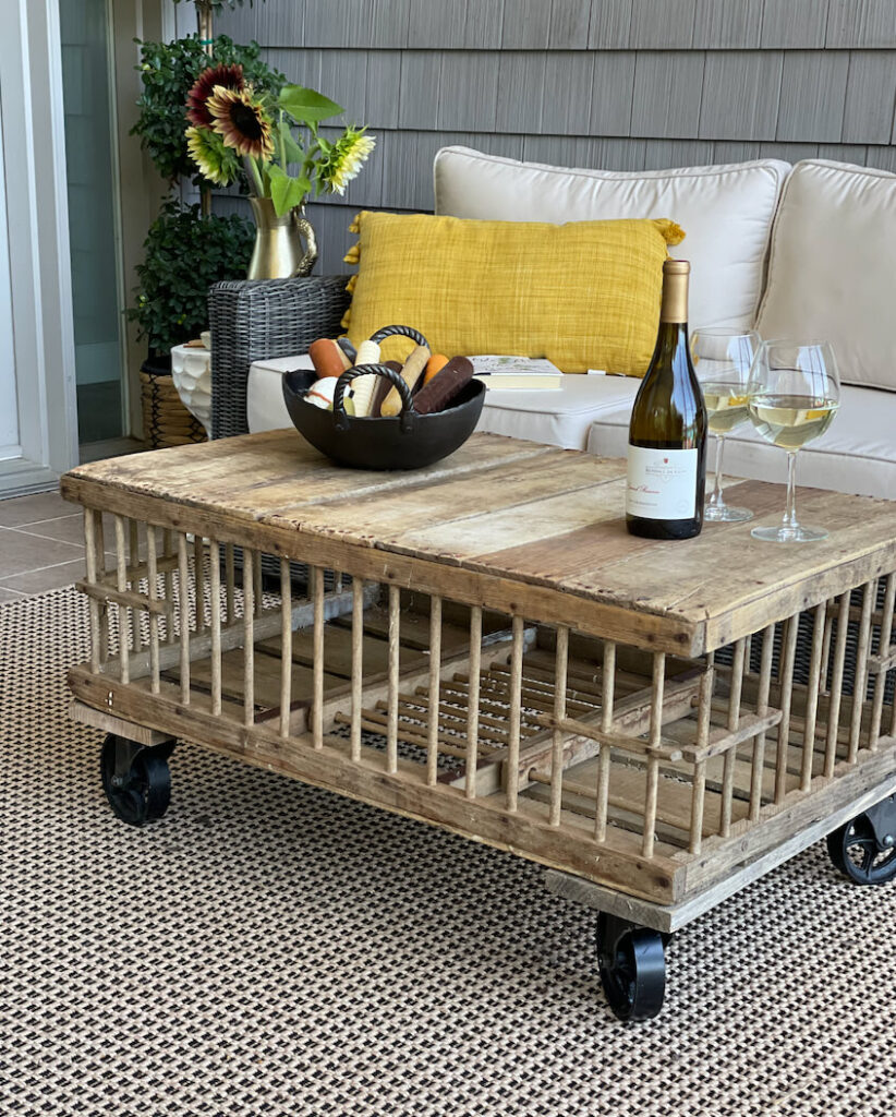 Vintage coffe table on a coverd porch.