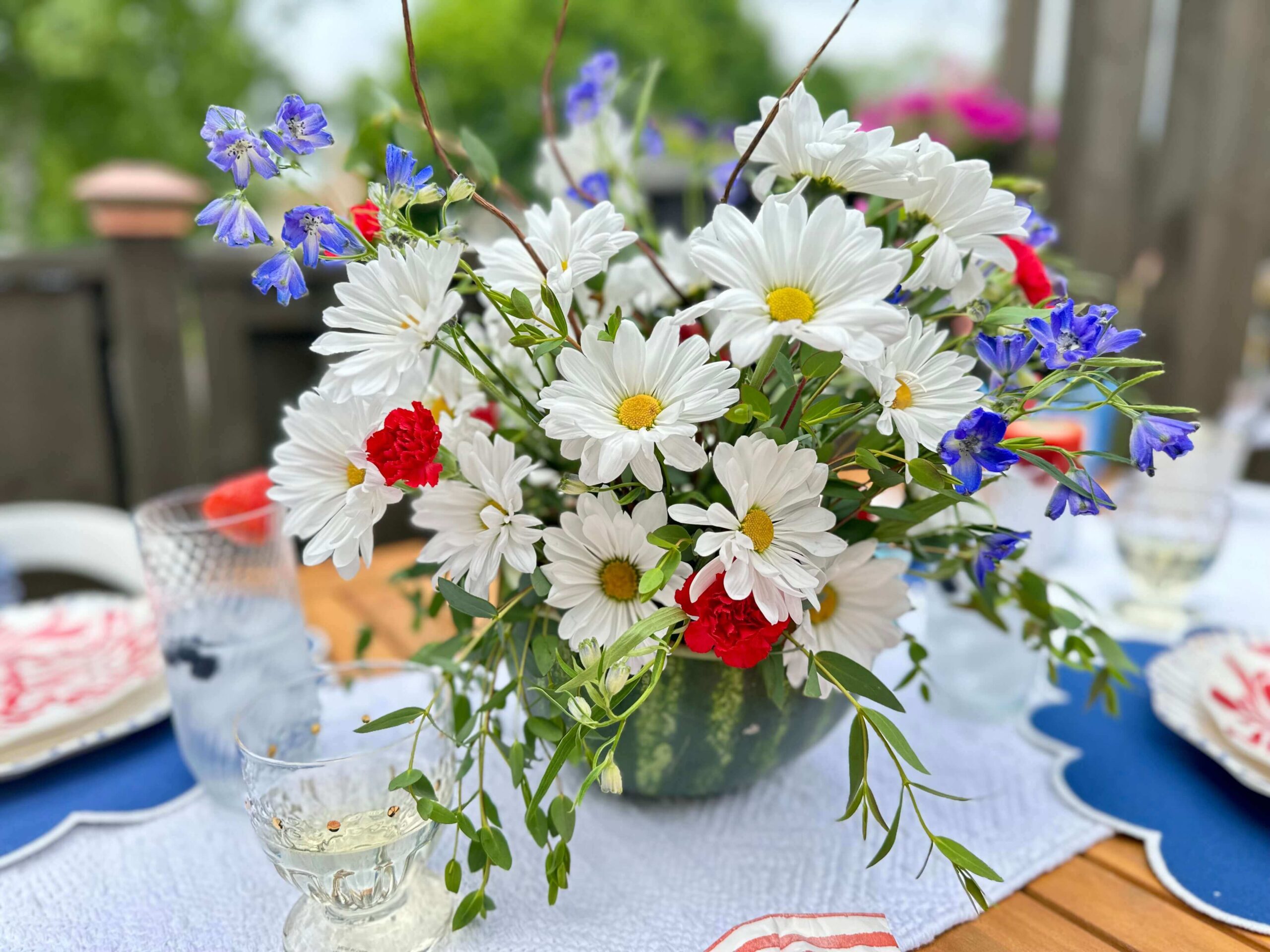 A DIY Watermelon Vase Flower arrangement for the Fourth of July.