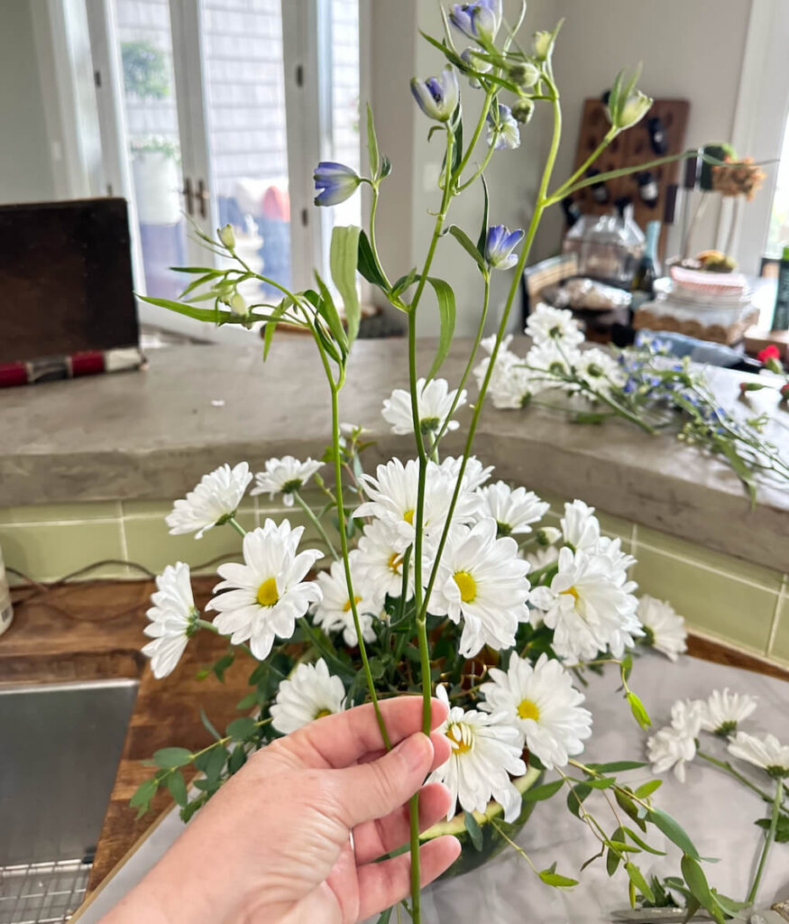 DIY 4th of July Floral Arrangement in a watermelon vase.