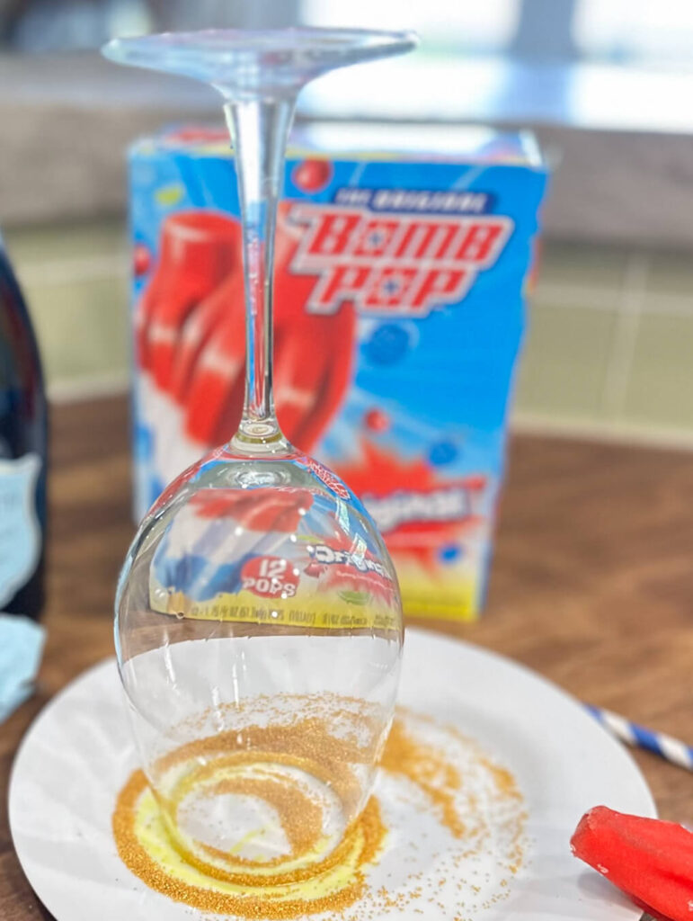 Gold sugar rim on a wine glass.